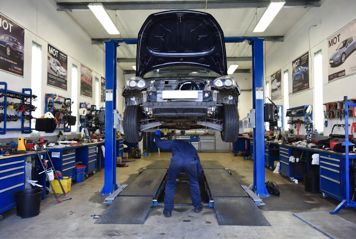 Garage mechanic working in a service bay while CallPilot answers calls